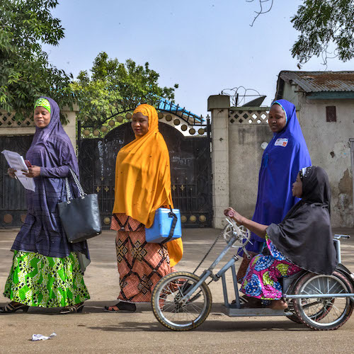 Faltmata Mustapha, a polio survivor, had accessibility challenges and relied on public transportation in her community before receiving a tricycle, donated by Rotary. It gives her independence, allowing her to travel outside of her neighborhood and join the door-to-door polio immunization campaign team. She works to convince parents of the importance of vaccination and increase in immunization compliance in the community. Buri Shehuri North, Maiduguri, Borno State, Nigeria. 29 April 2019. Find the story in "The Rotarian," October 2019.