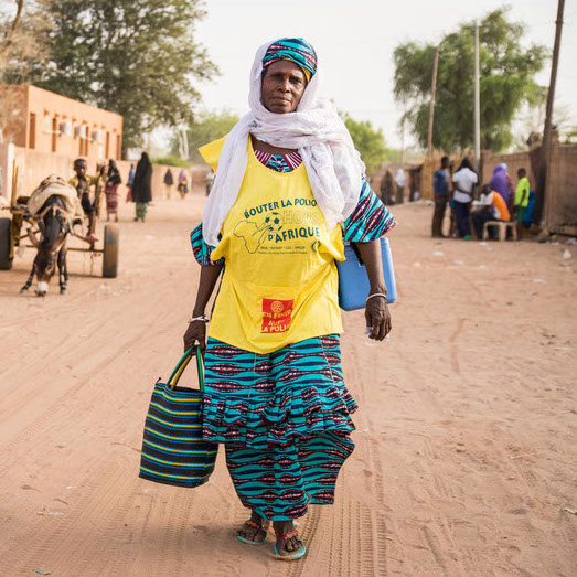 Community health worker Hawa Amadou, 70 years old walks through a community in Dosso, Dosso region, Niger on April 22, 2017. She is a commencing house to house visits administering the polio vaccination Biopolio B1/3.

Hawa says “It's been 30 years since I have been undertaking this work, since the creation of the district health centre in Dosso. I undertake social mobilization activities for malaria, tuberculosis, malnutrition and polio. I enjoy my work because I want to help my community. I trust them and they trust me.”