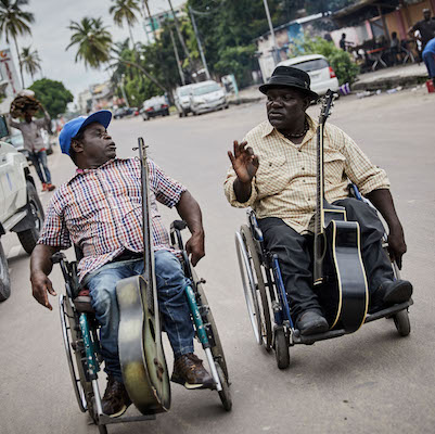 Musicians Theo Nzonza and Koko Ngambalia , Theo and Koko are members of the band Mbongwana Star but have been active in Congo's music scene for many years, both are survivors of Polio.