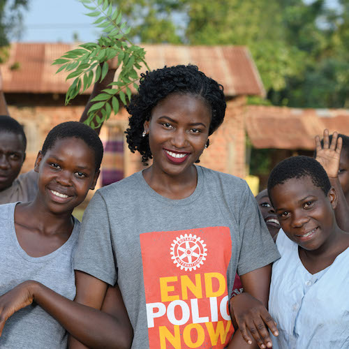 Patience Asiimwe (center), a Rotaractor who traveled in her native Uganda with a polio vaccination team as part of Rotary's virtual reality film, Two Drops of Patience. 28 July 2018, Kampala, Uganda. Appeared in "The Rotarian," October 2018, cover page.