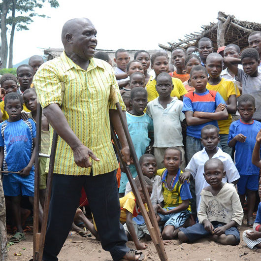 Roger Vuanda Movita was only two when polio took away his ability to walk. The crippling disease, locally known as buka-buka, has since hindered his life. The seventeen surgical operations he has undergone throughout his lifetime have not allowed him to fully regain the use of his lower limbs. Nevertheless, today at age 58, Roger is a successful sports journalist in Bas Congo province of the Democratic Republic of the Congo.